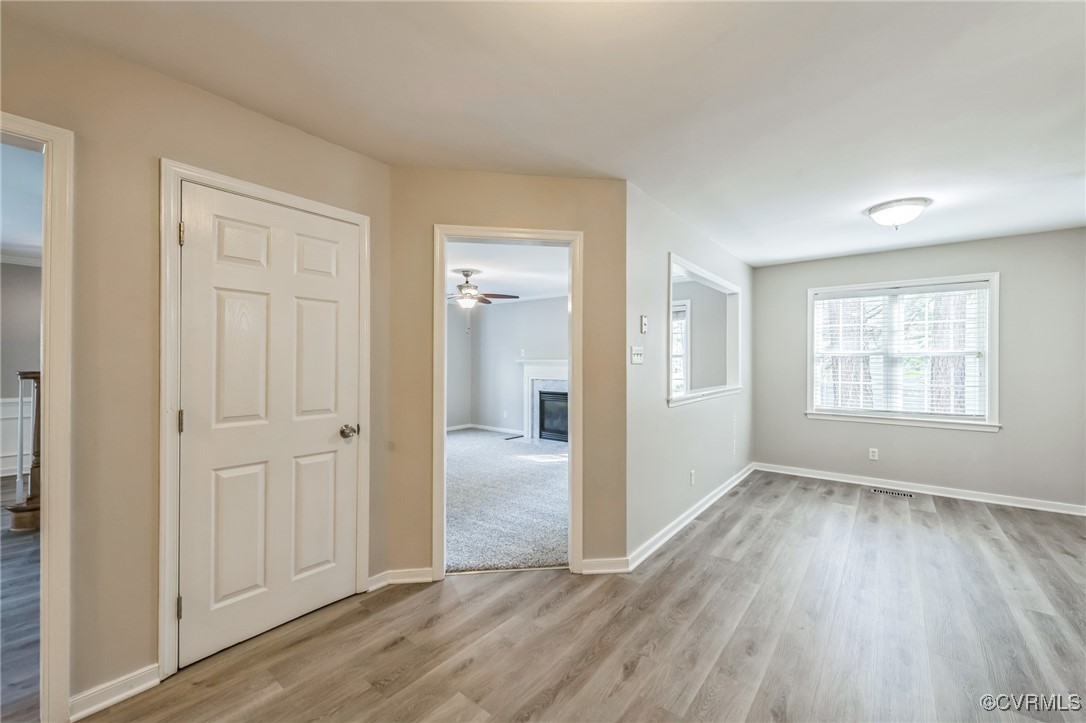12004 Taplow Road Midlothian, VA 23112 - Photo 13 of 32 an empty room with wooden floor closet and windows