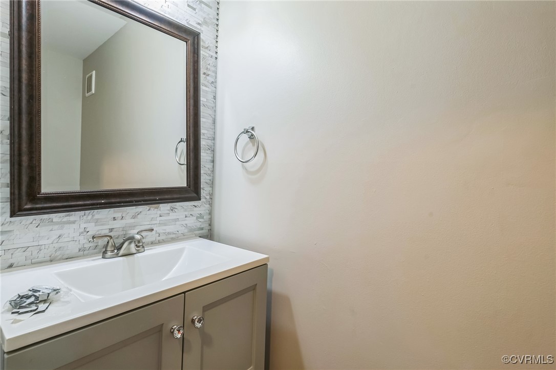 12004 Taplow Road Midlothian, VA 23112 - Photo 16 of 32 a bathroom with a sink and a mirror