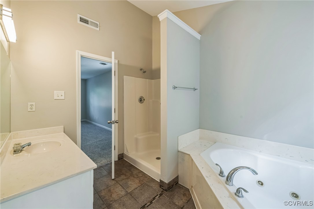 12004 Taplow Road Midlothian, VA 23112 - Photo 23 of 32 a bathroom with a tub sink and mirror