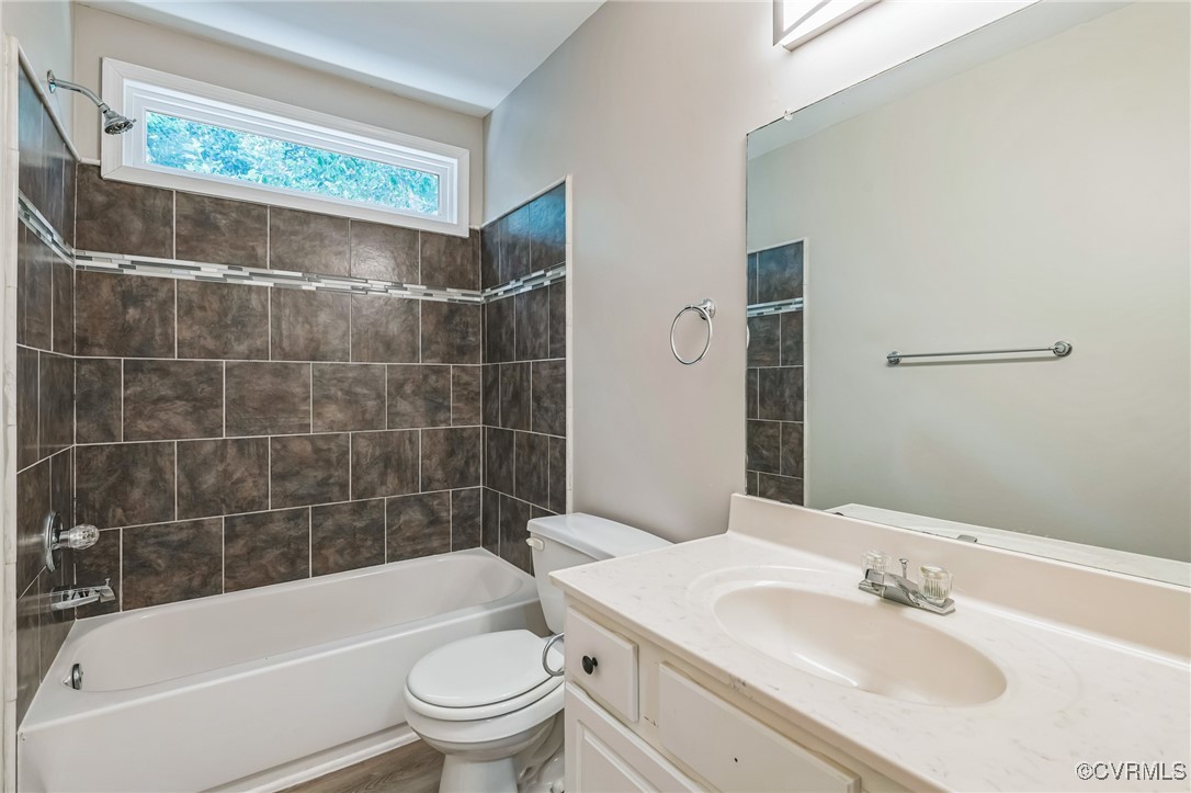 12004 Taplow Road Midlothian, VA 23112 - Photo 27 of 32 a bathroom with a sink toilet and shower