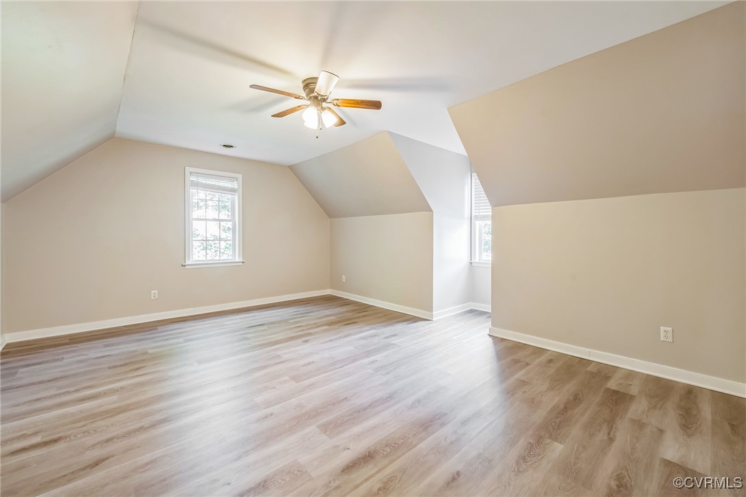 12004 Taplow Road Midlothian, VA 23112 - Photo 28 of 32 an empty room with wooden floor fan and windows