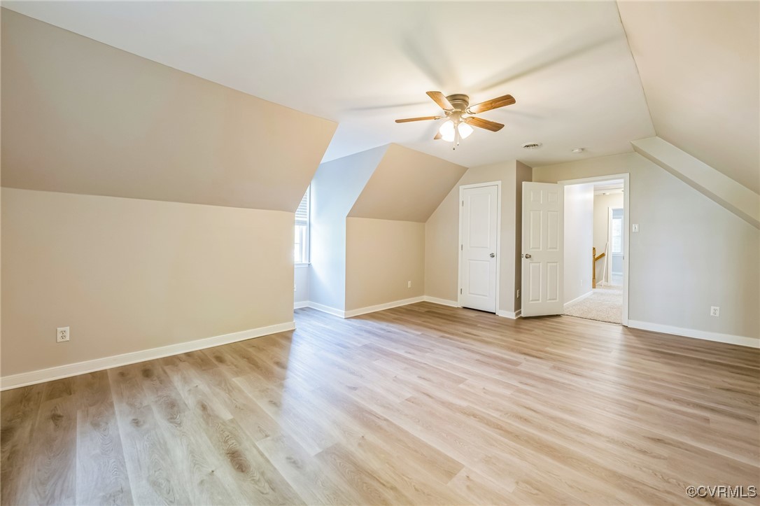 12004 Taplow Road Midlothian, VA 23112 - Photo 29 of 32 an empty room with wooden floor fan and windows
