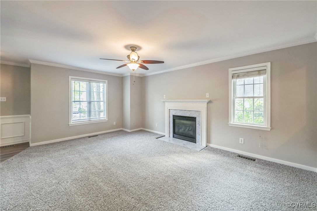 12004 Taplow Road Midlothian, VA 23112 - Photo 4 of 32 an empty room with windows and fireplace