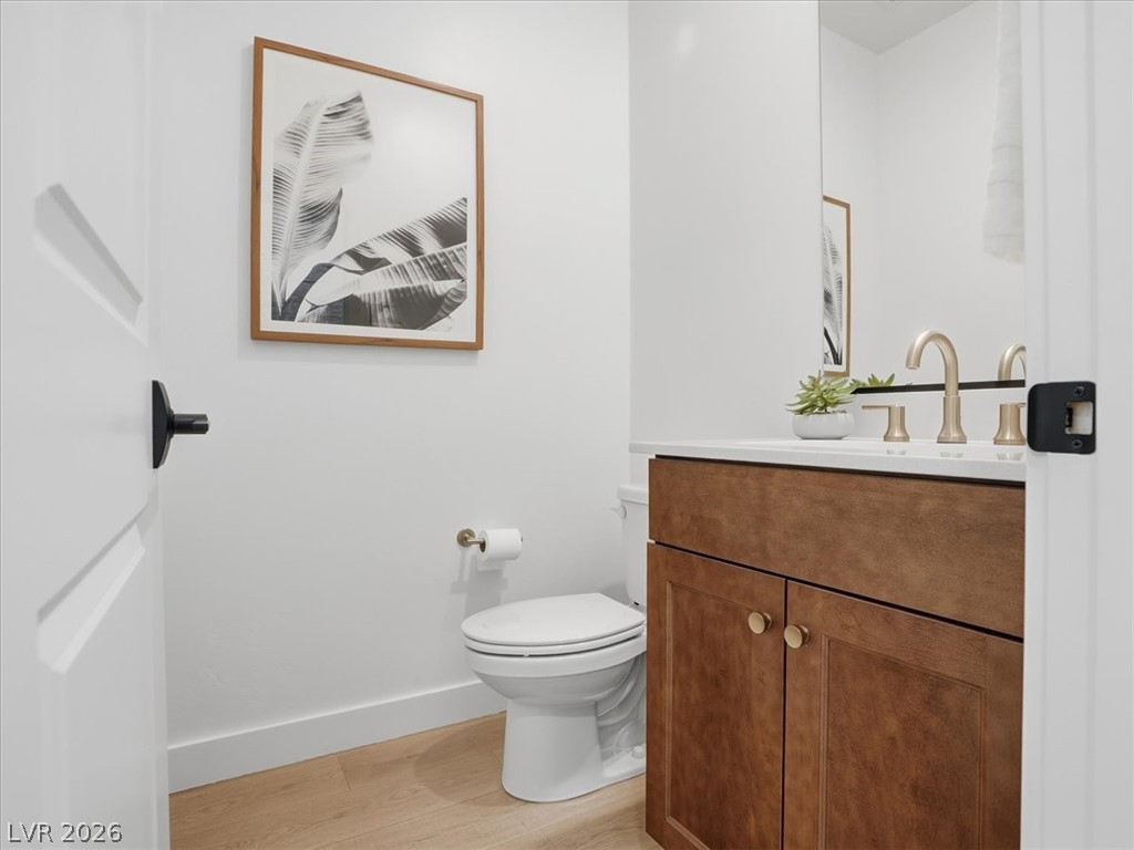 9725 Starlight Ridge Avenue Las Vegas, NV 89148 - Photo 27 of 47 This sleek powder room features modern fixtures and ample storage, providing comfort and convenience.