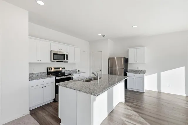 a view of a kitchen with a sink