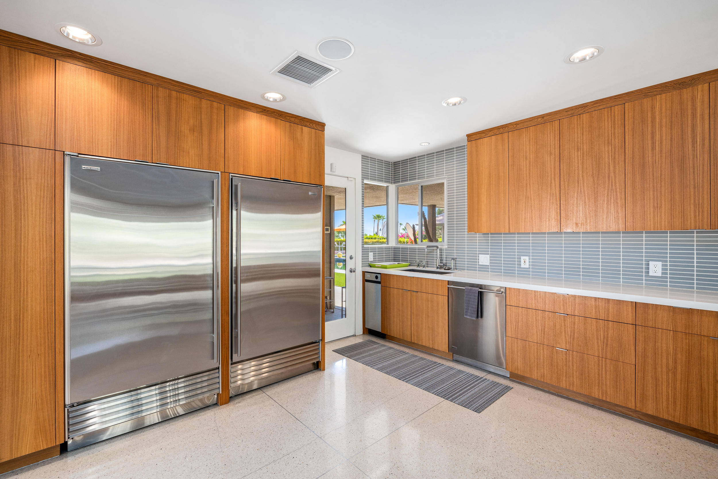 70411 Pecos Road Rancho Mirage, CA 92270 - Photo 11 of 44 a kitchen with stainless steel appliances granite countertop a refrigerator and a sink