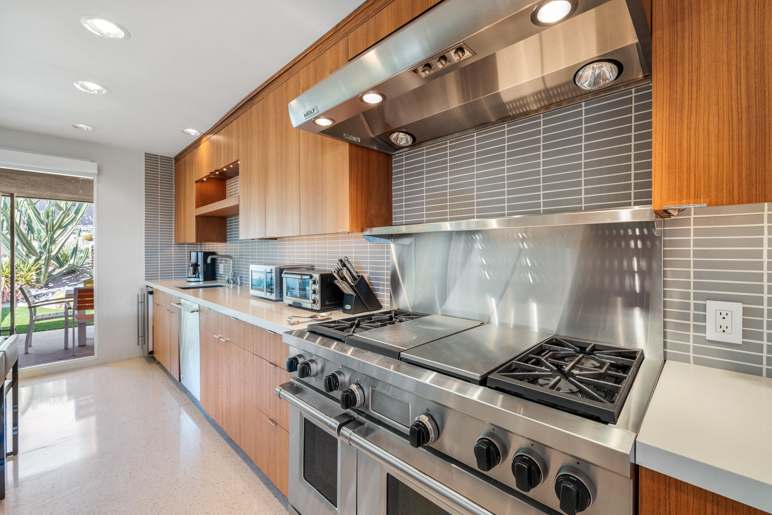 70411 Pecos Road Rancho Mirage, CA 92270 - Photo 12 of 44 a kitchen with a stove and a sink