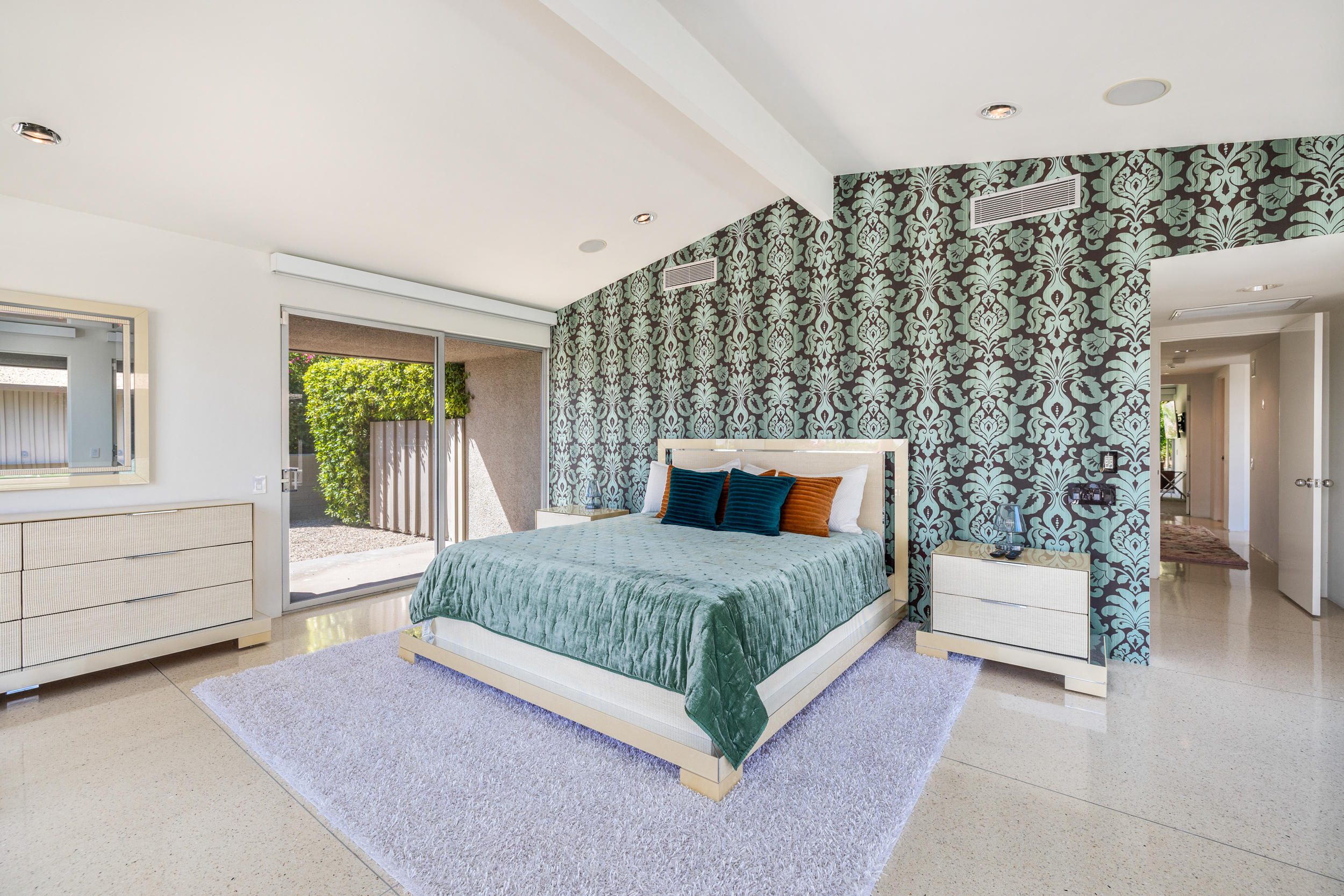 70411 Pecos Road Rancho Mirage, CA 92270 - Photo 16 of 44 a spacious bedroom with a bed and a window