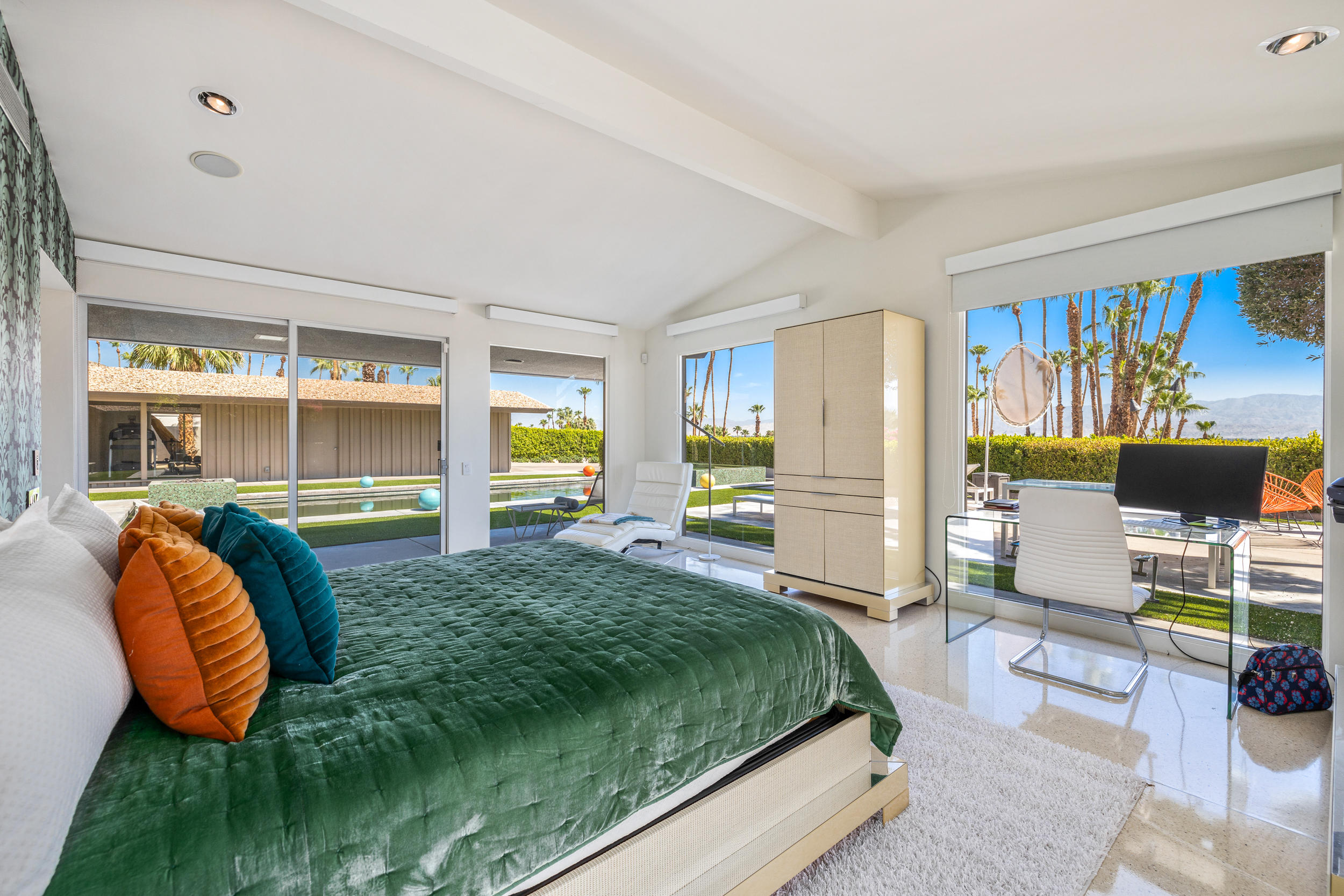 70411 Pecos Road Rancho Mirage, CA 92270 - Photo 17 of 44 a bedroom with a bed and a chair