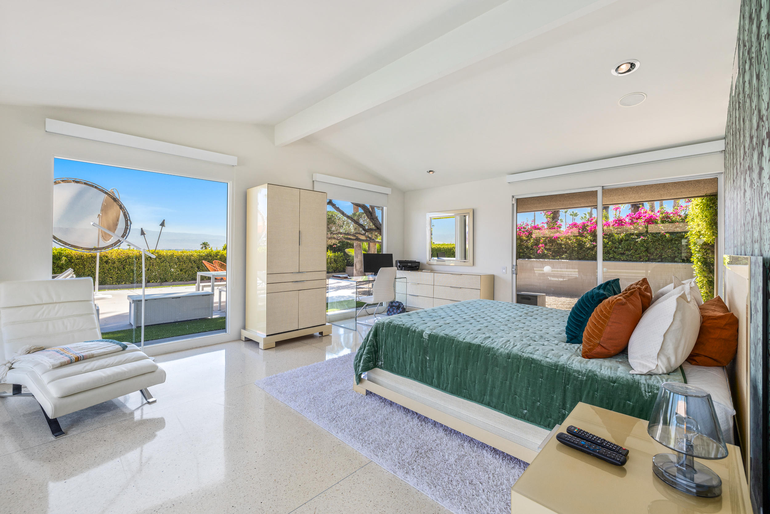 70411 Pecos Road Rancho Mirage, CA 92270 - Photo 18 of 44 a bedroom with a bed a couch and dresser