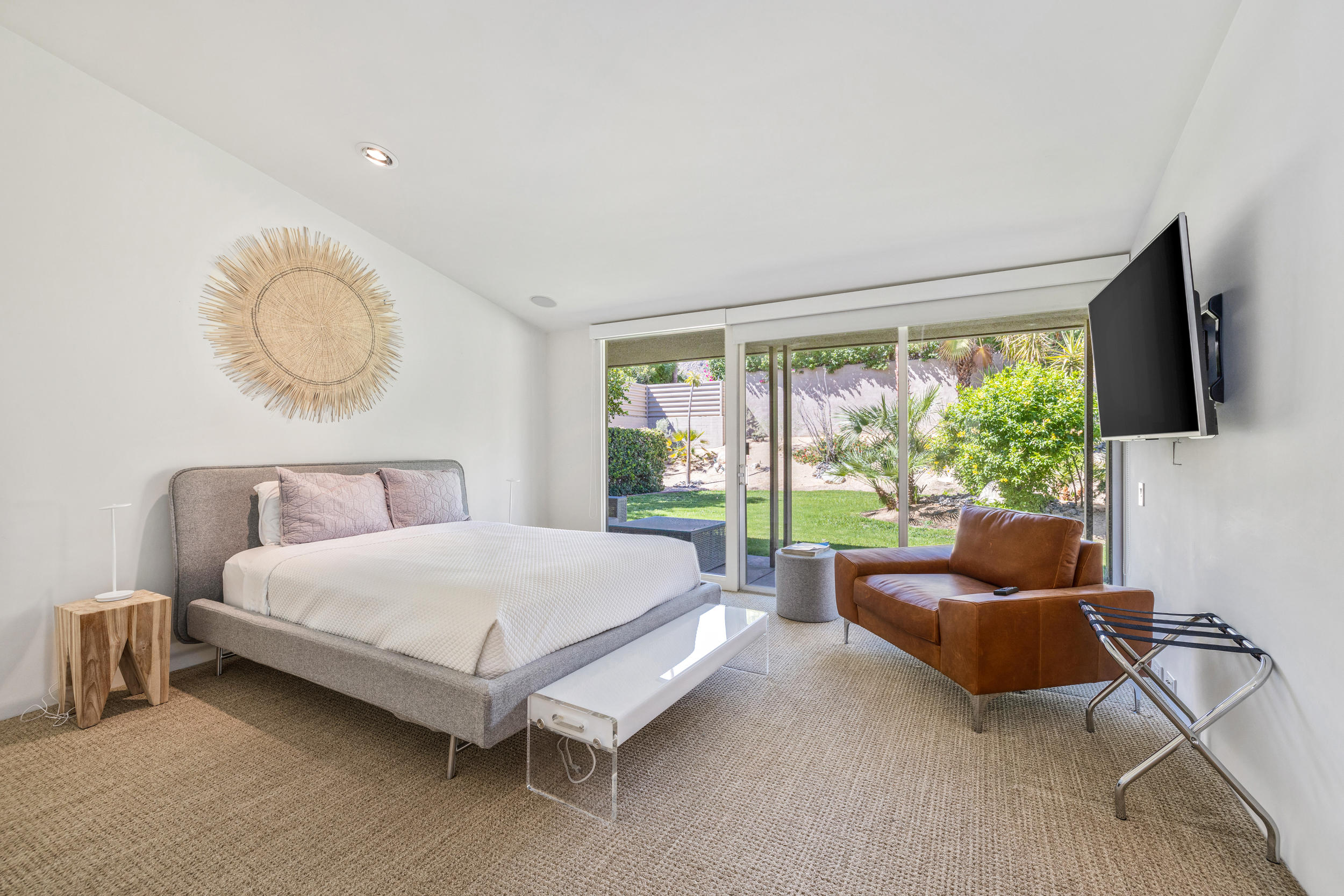 70411 Pecos Road Rancho Mirage, CA 92270 - Photo 22 of 44 a spacious bedroom with a bed and glass window