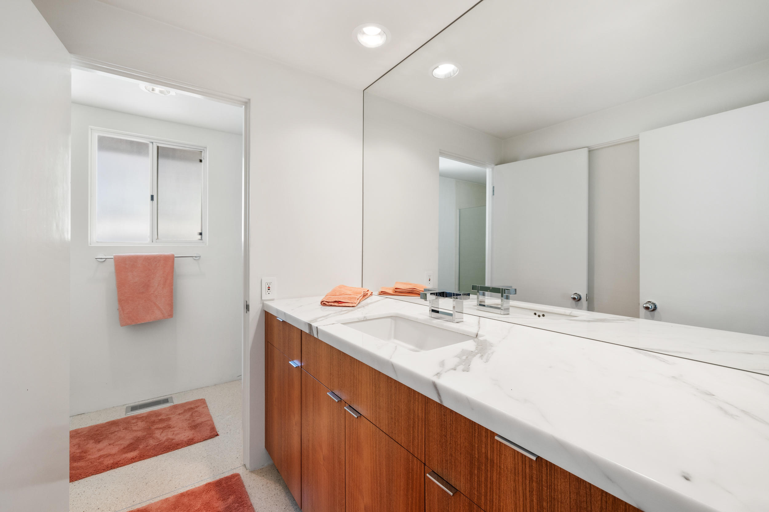 70411 Pecos Road Rancho Mirage, CA 92270 - Photo 26 of 44 a bathroom with a sink and mirror