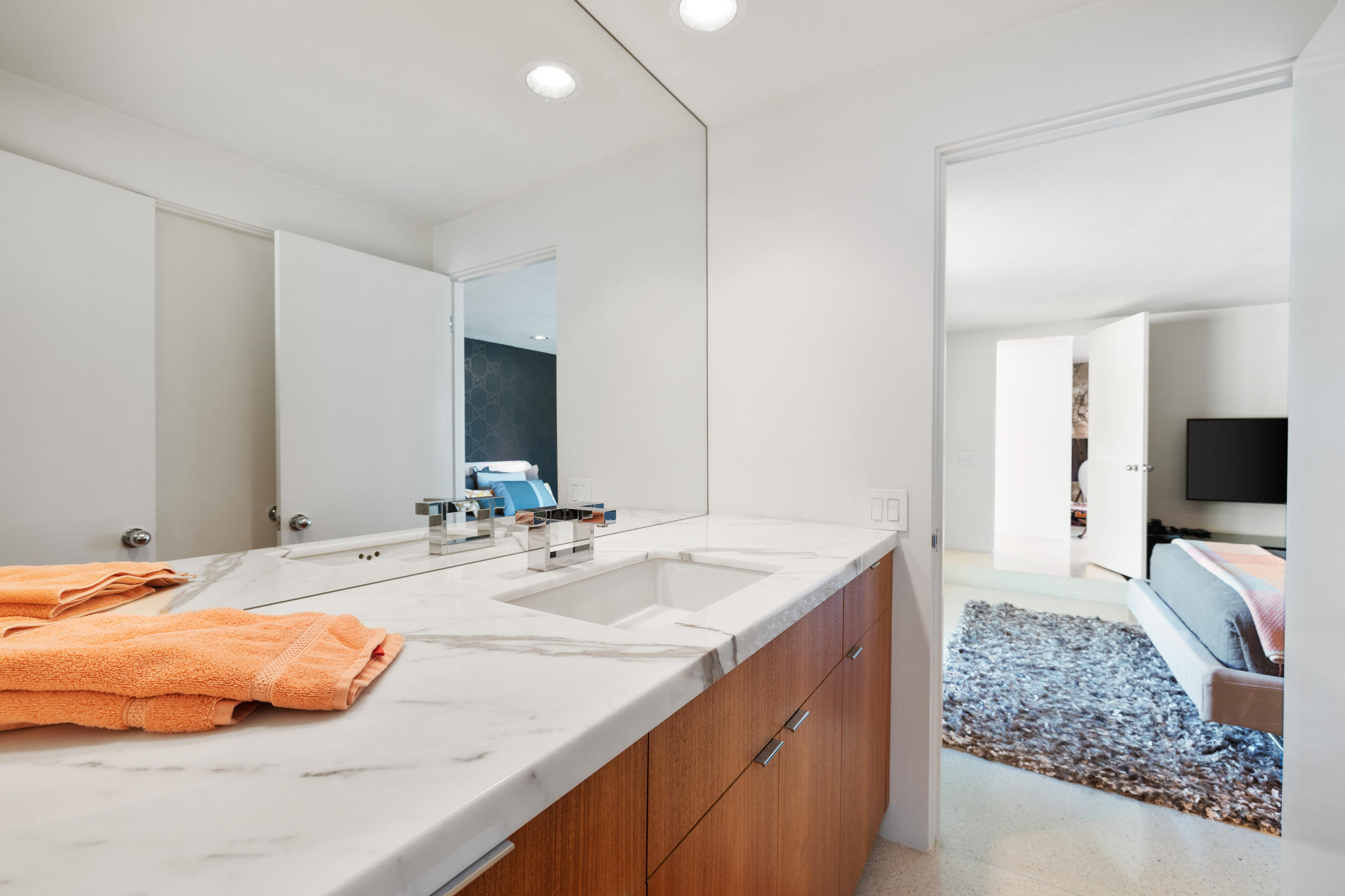 70411 Pecos Road Rancho Mirage, CA 92270 - Photo 28 of 44 a bathroom with a sink and a mirror