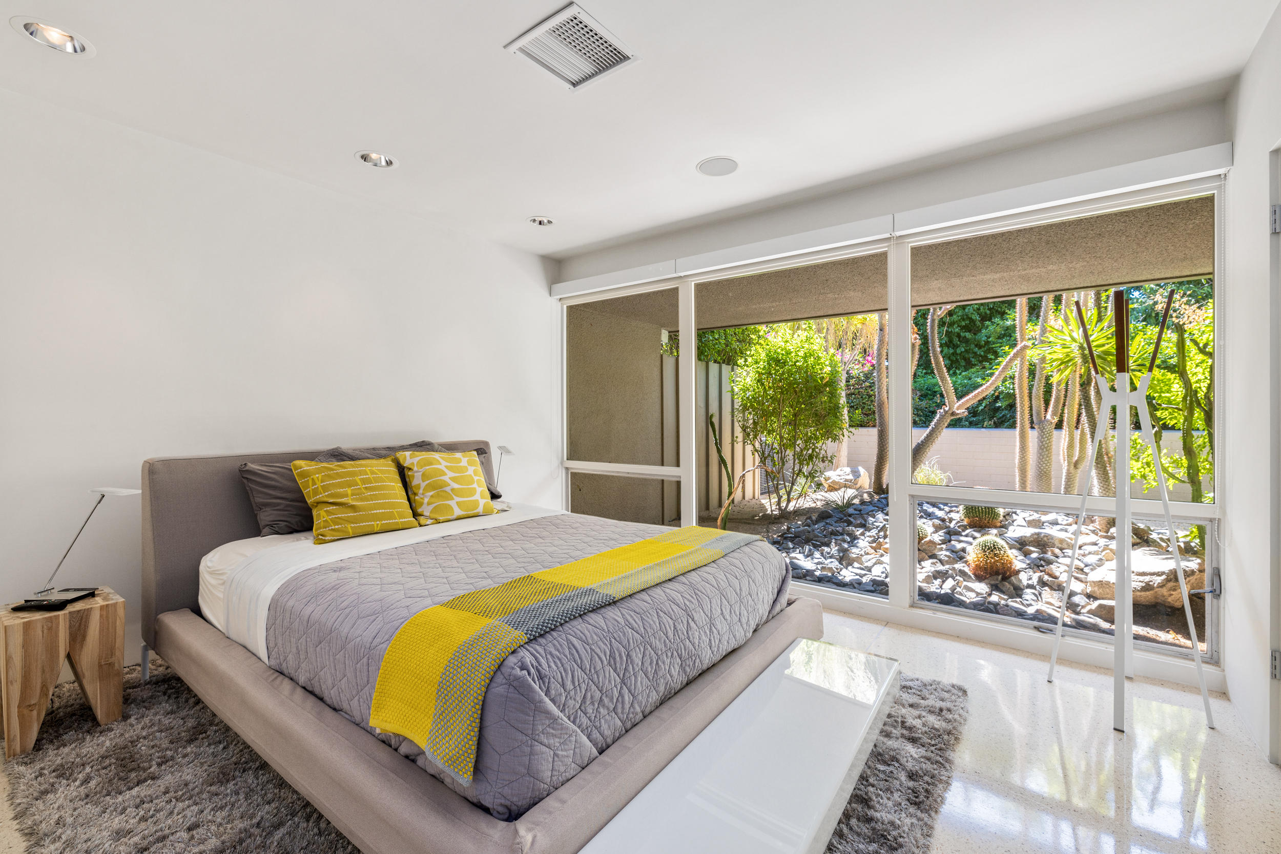 70411 Pecos Road Rancho Mirage, CA 92270 - Photo 29 of 44 a bedroom with a bed and a large window