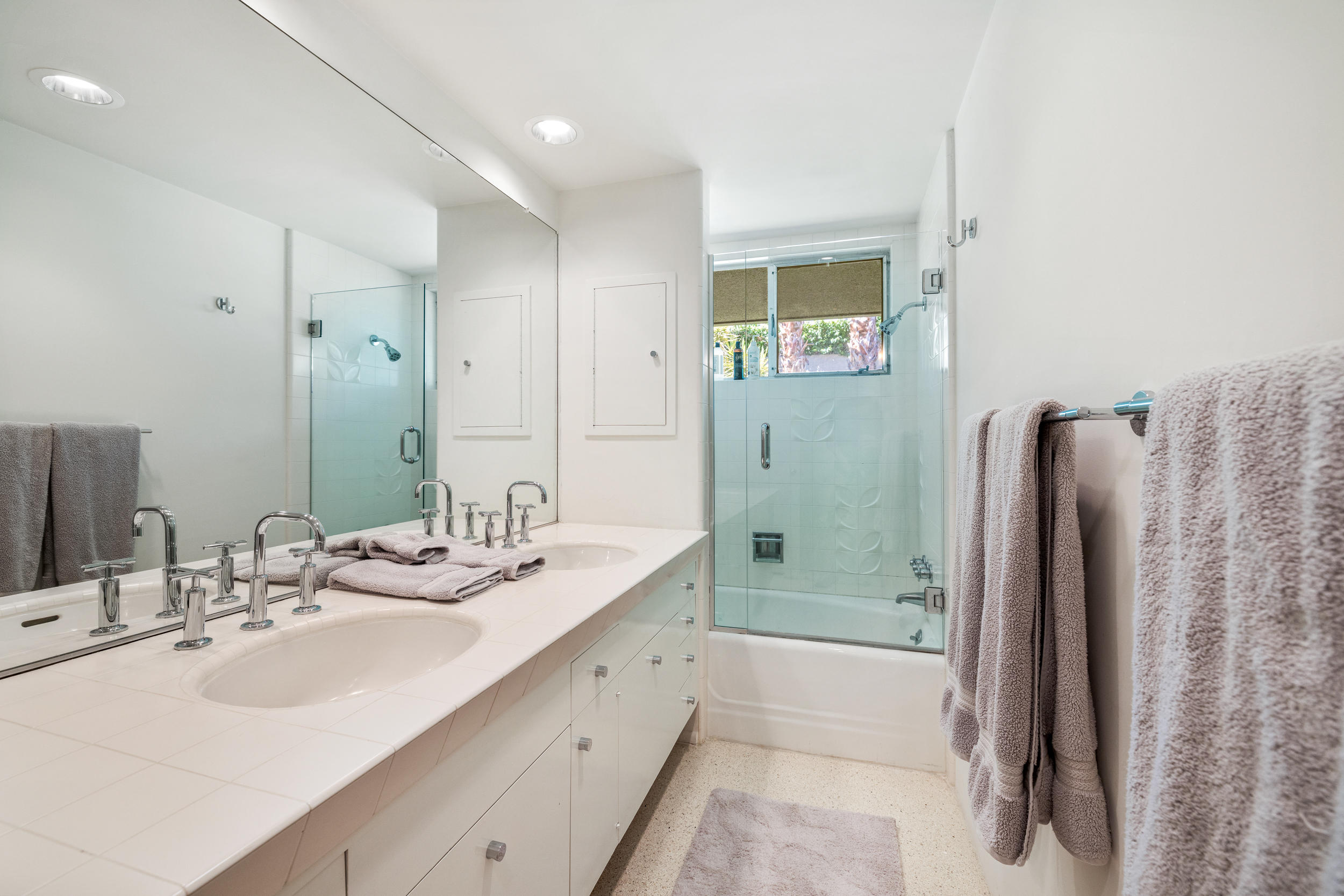 70411 Pecos Road Rancho Mirage, CA 92270 - Photo 32 of 44 a bathroom with a double vanity sink shower and a mirror