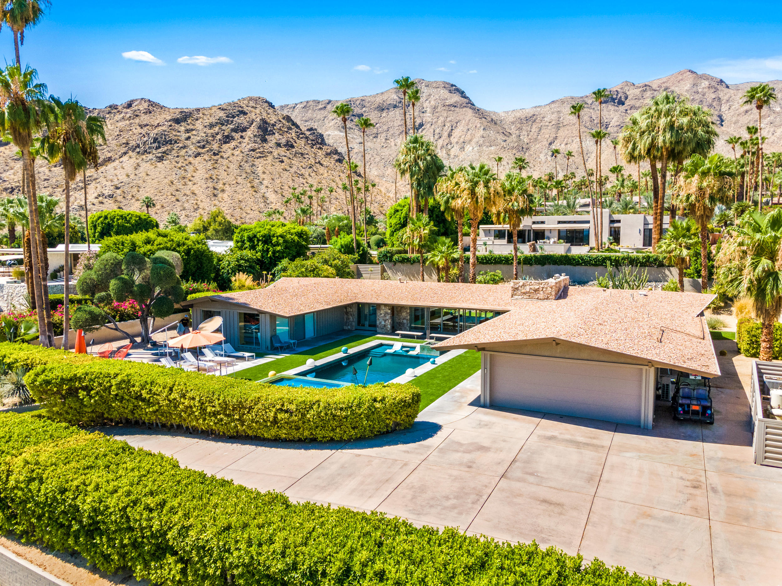 70411 Pecos Road Rancho Mirage, CA 92270 - Photo 34 of 44 a view of a swimming pool with a yard