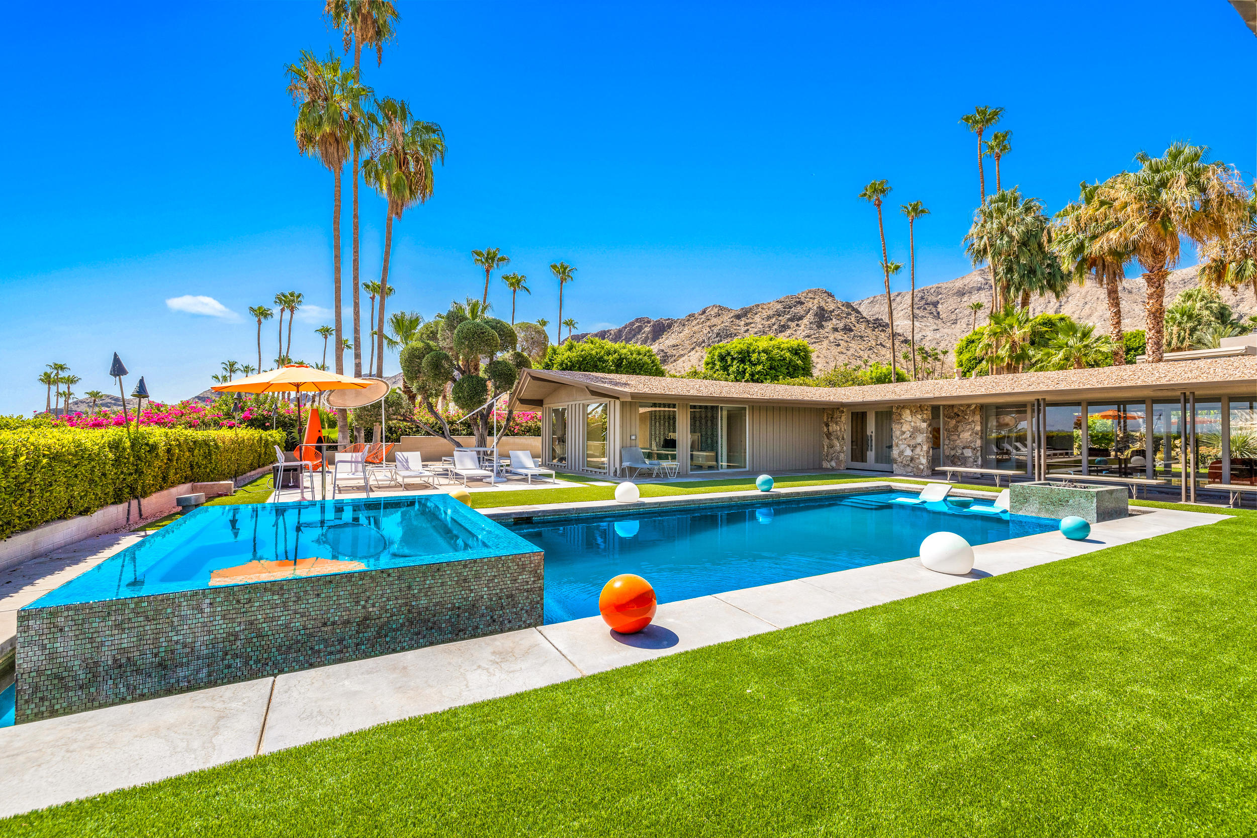 70411 Pecos Road Rancho Mirage, CA 92270 - Photo 35 of 44 a view of an house with swimming pool yard and outdoor seating