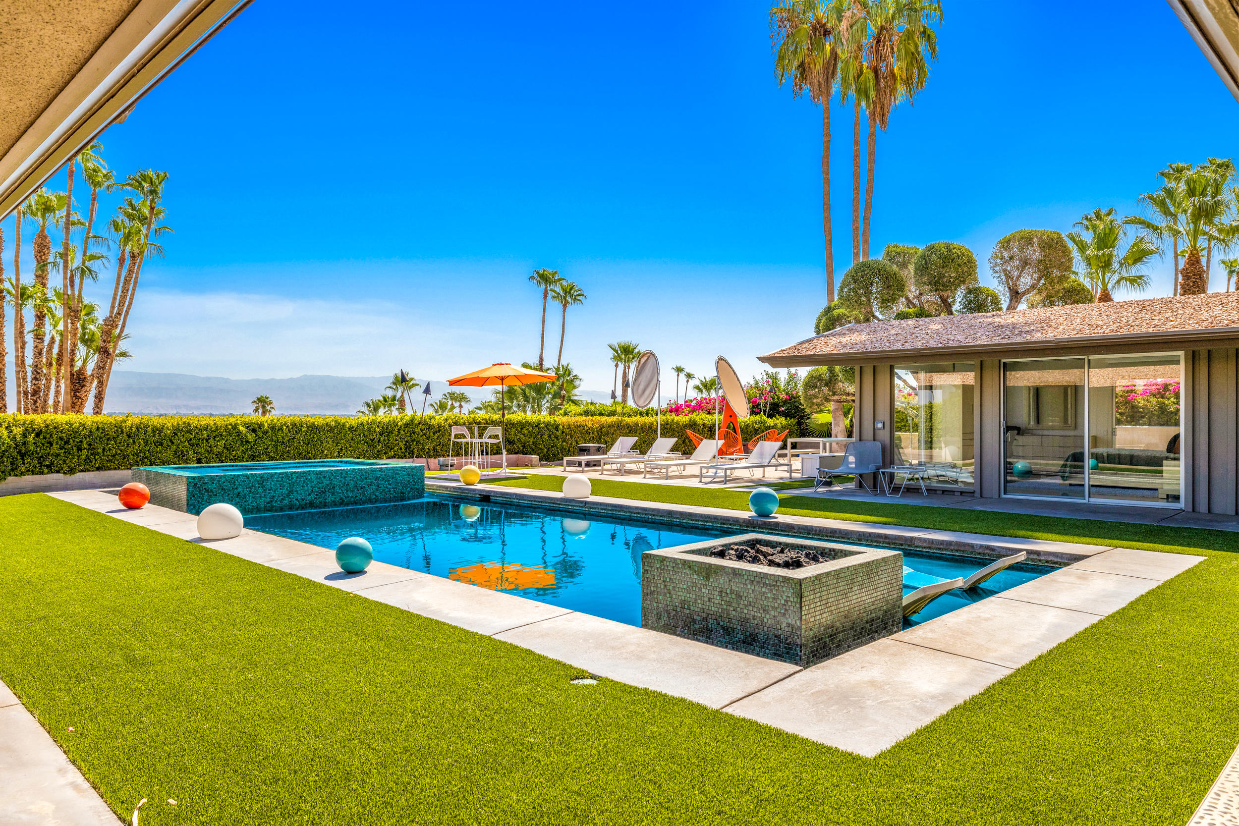 70411 Pecos Road Rancho Mirage, CA 92270 - Photo 36 of 44 a view of a house with swimming pool yard and outdoor seating