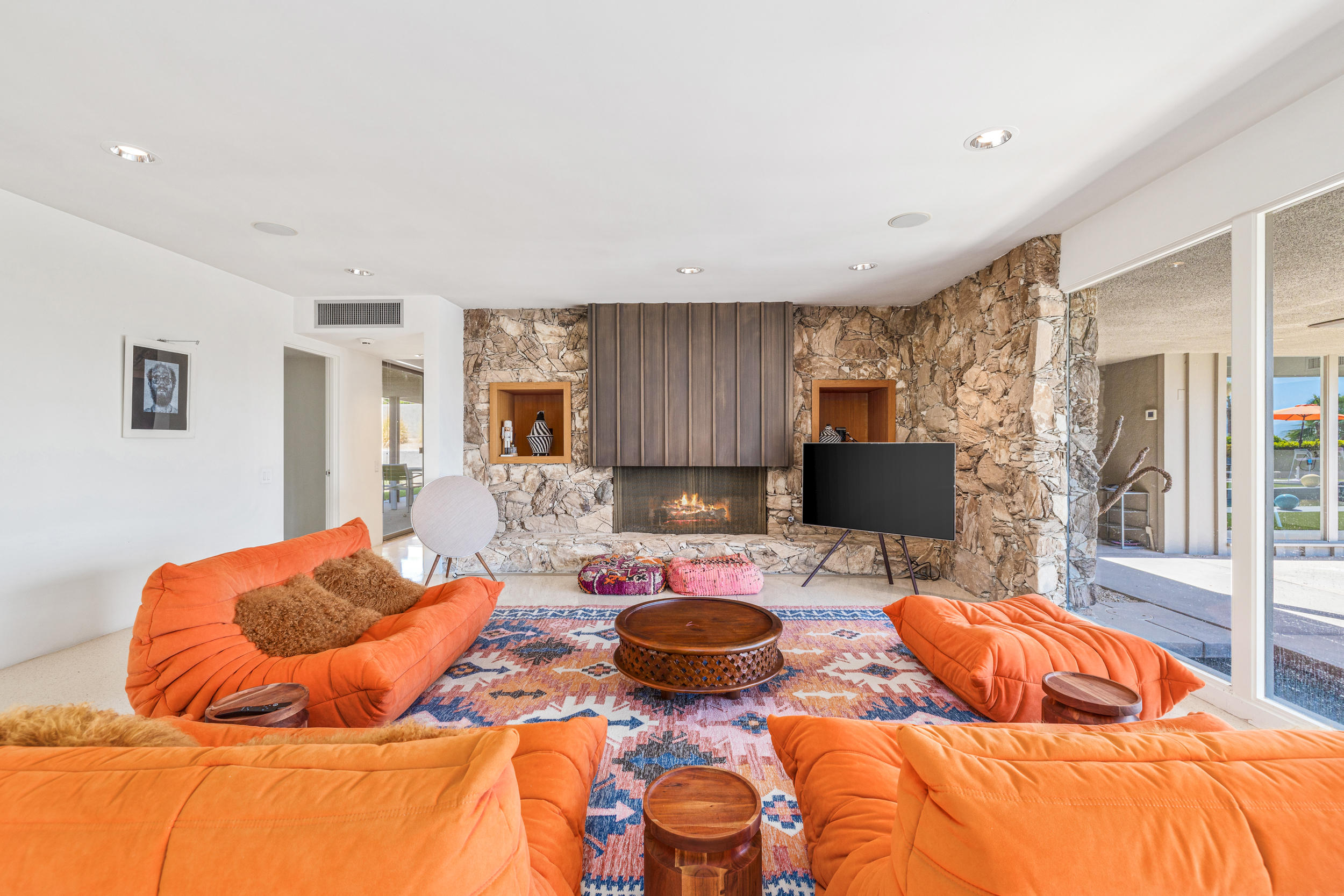 70411 Pecos Road Rancho Mirage, CA 92270 - Photo 5 of 44 a living room with blue lights with furniture and a kitchen view
