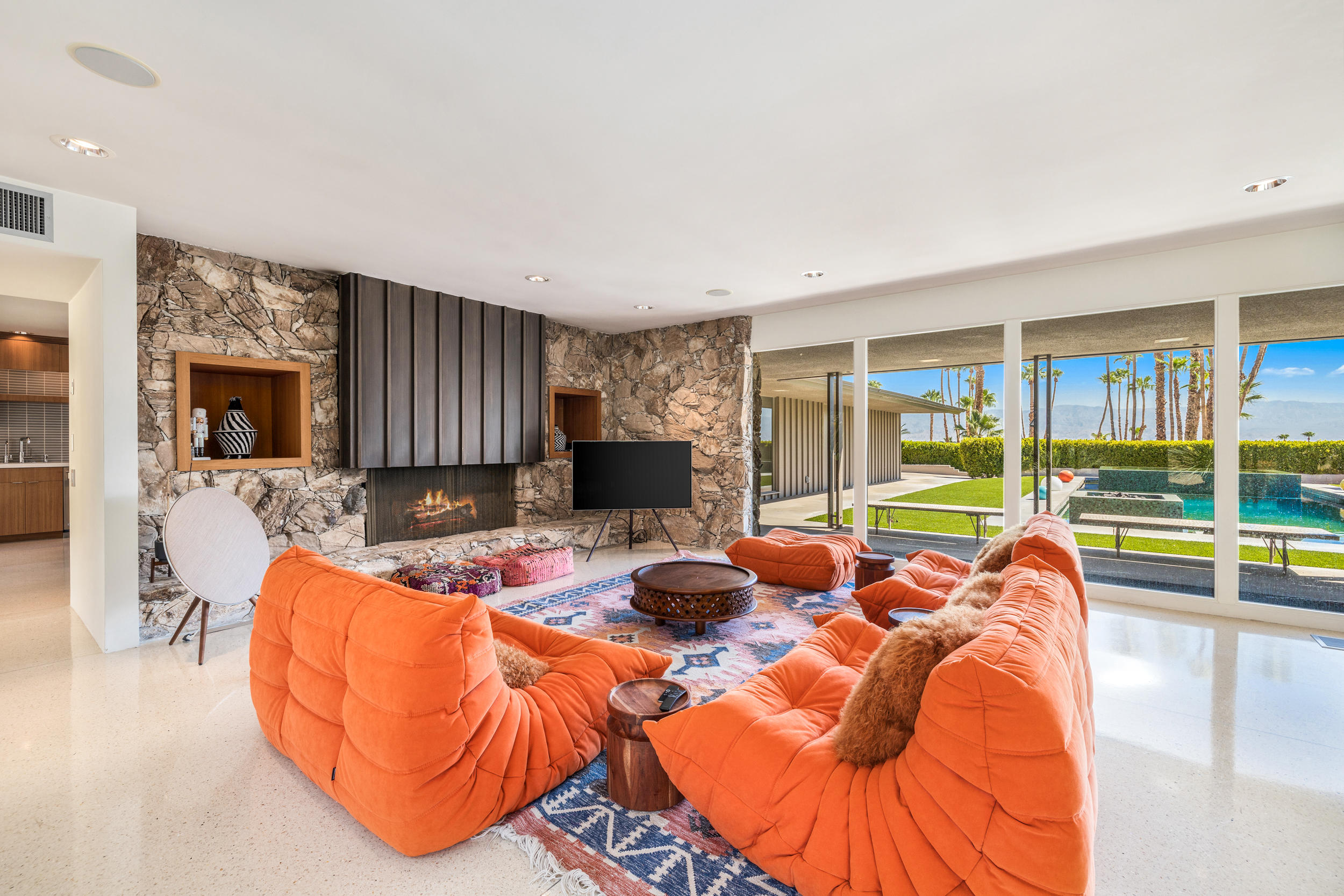 70411 Pecos Road Rancho Mirage, CA 92270 - Photo 6 of 44 a living room with furniture a fireplace and a flat screen tv
