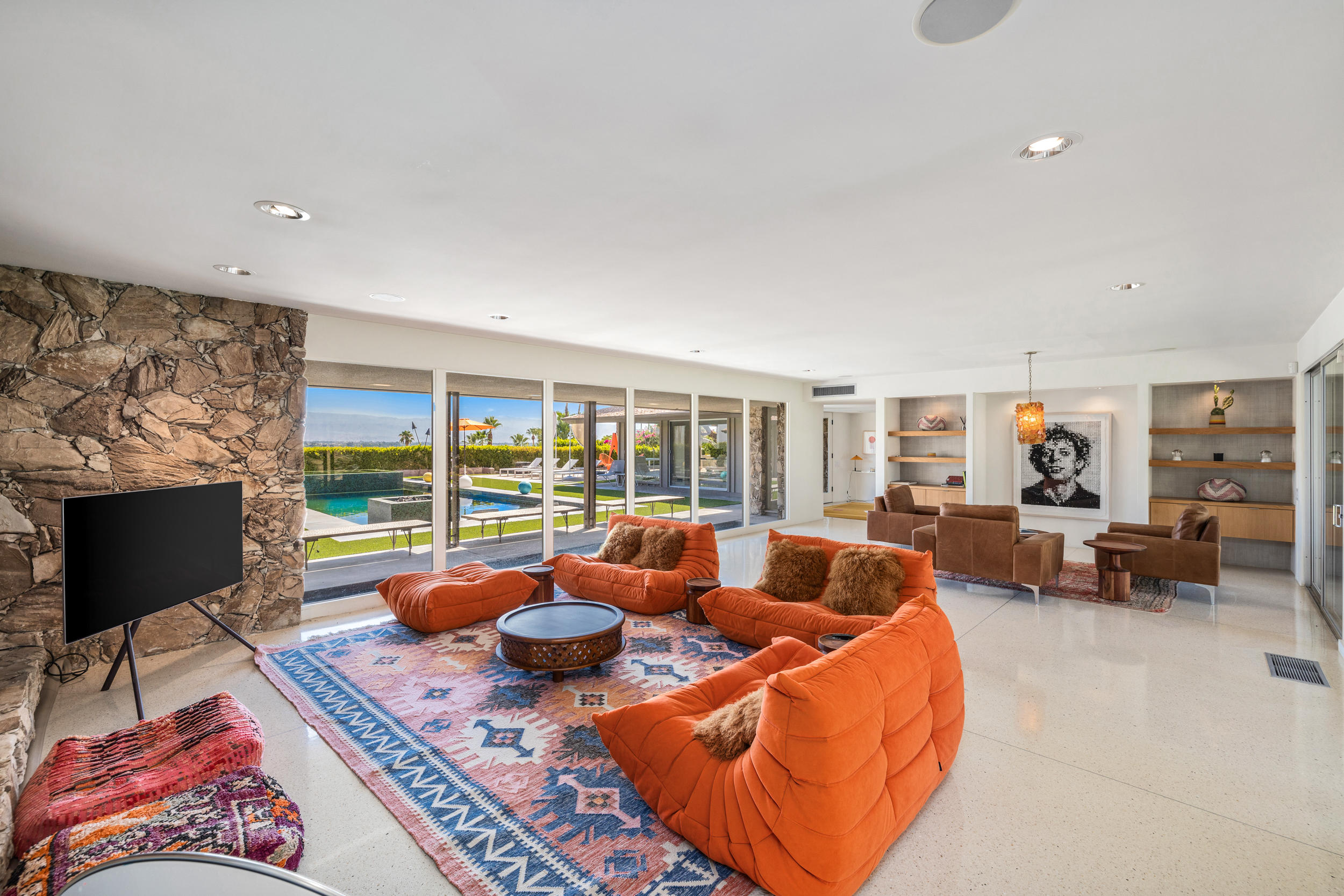 70411 Pecos Road Rancho Mirage, CA 92270 - Photo 8 of 44 a living room with furniture large window and a flat screen tv