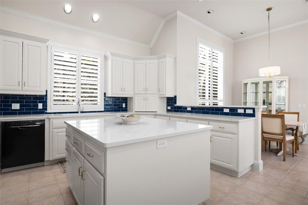 14725 Celestial Place Addison, TX 75254 - Photo 19 of 31 a kitchen with stainless steel appliances granite countertop a sink a stove a refrigerator and cabinets
