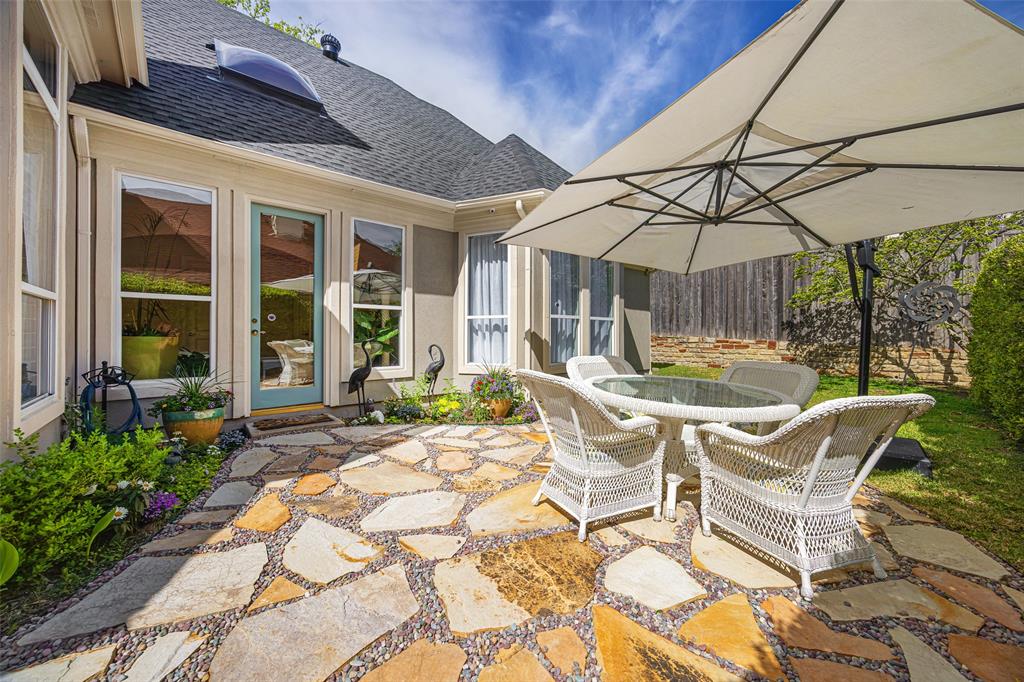 14725 Celestial Place Addison, TX 75254 - Photo 22 of 31 a backyard of a house with yard and outdoor seating