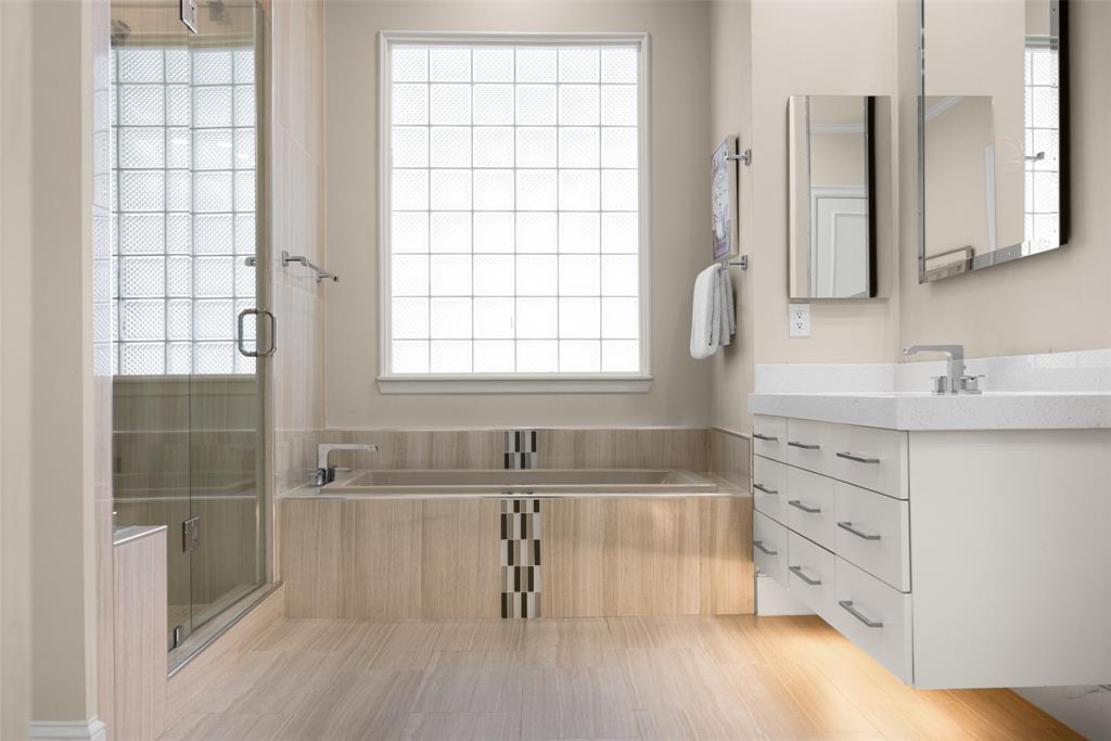 14725 Celestial Place Addison, TX 75254 - Photo 23 of 31 a bathroom with a bathtub sink and mirror