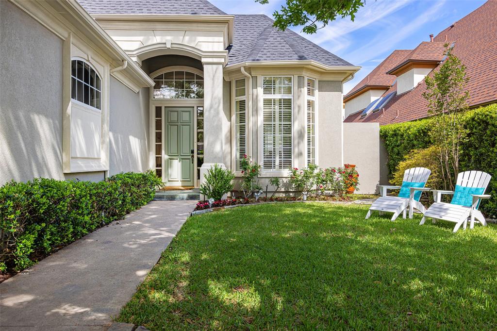 14725 Celestial Place Addison, TX 75254 - Photo 27 of 31 a front view of a house with garden and porch