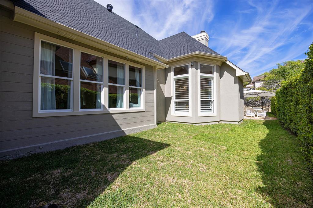 14725 Celestial Place Addison, TX 75254 - Photo 28 of 31 a view of a brick house with a yard