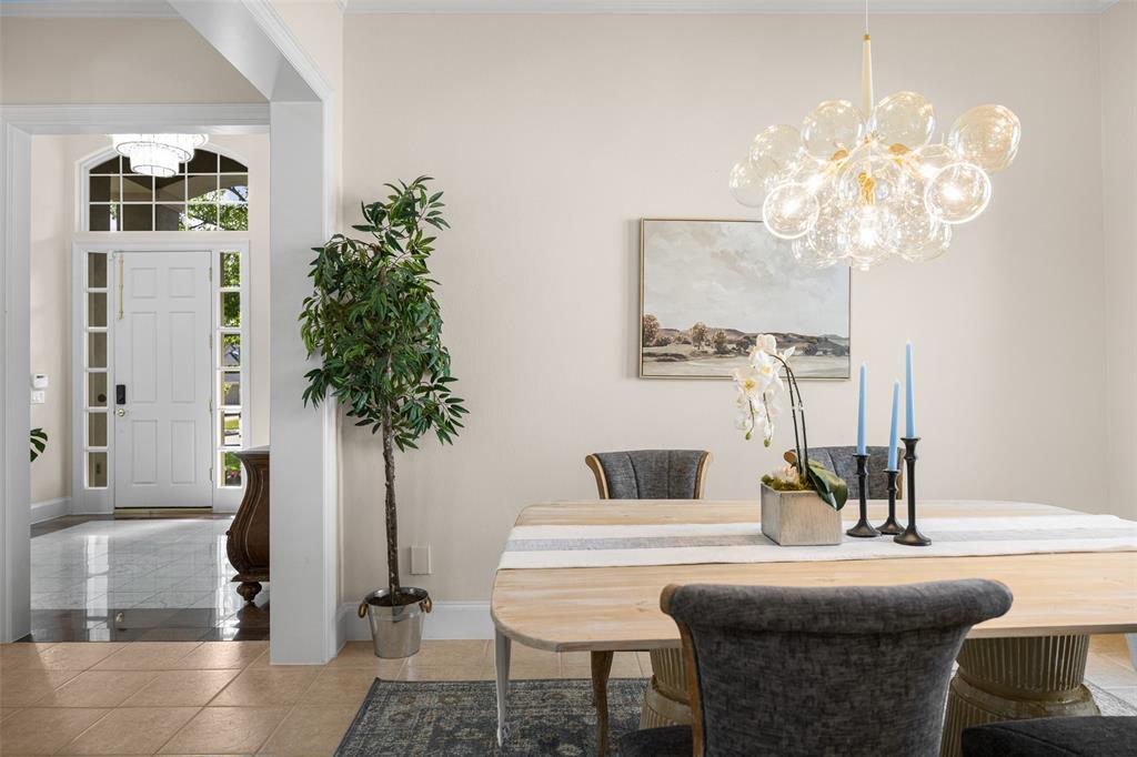 14725 Celestial Place Addison, TX 75254 - Photo 5 of 31 a living room with furniture and a chandelier