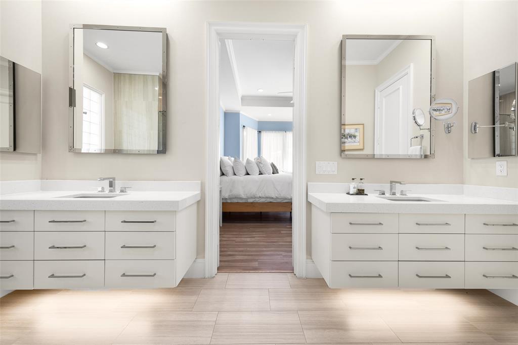 14725 Celestial Place Addison, TX 75254 - Photo 8 of 31 a bathroom with double vanity sink and a mirror