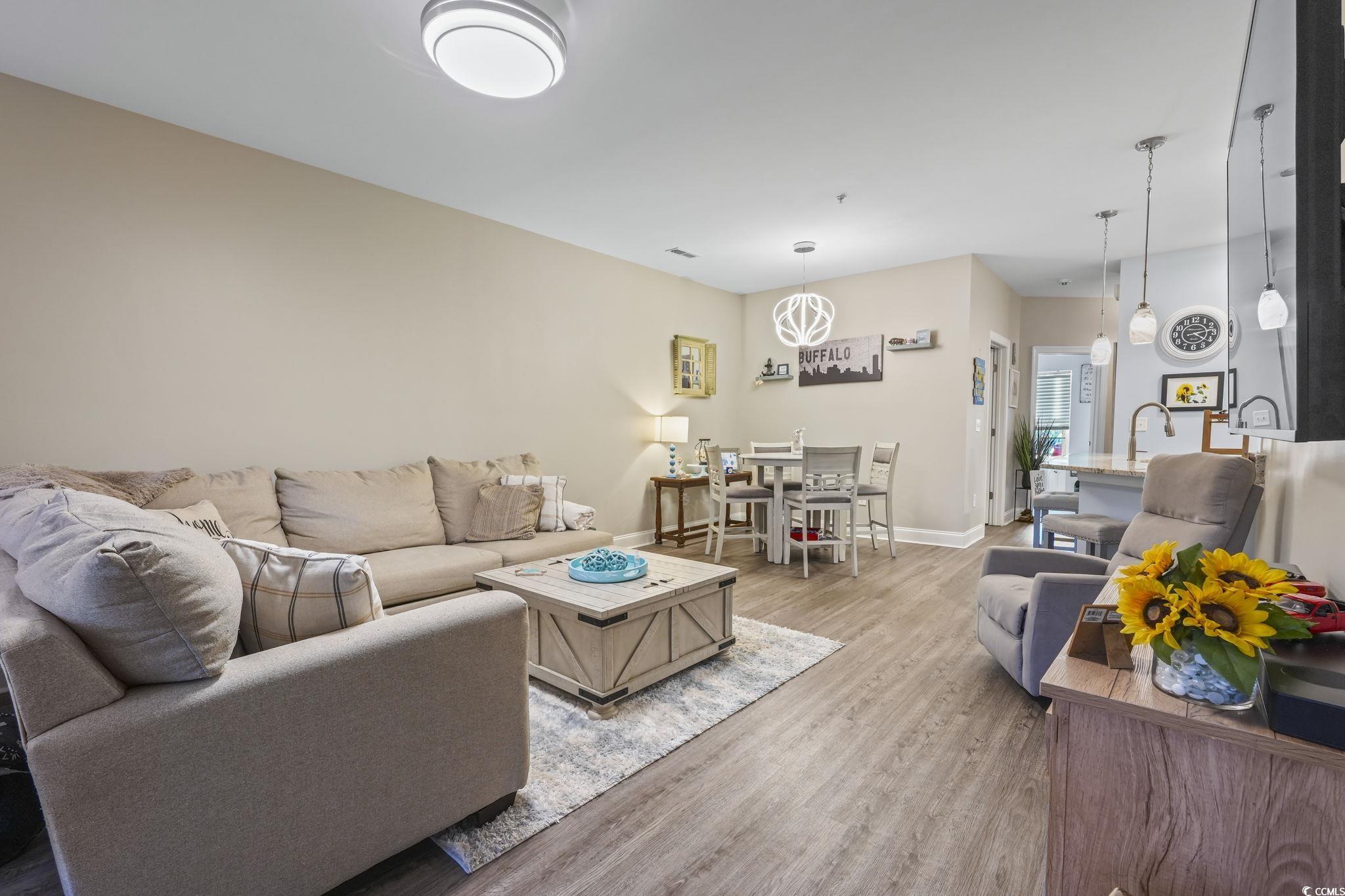 124 Birch N Coppice Drive, Unit 3 Surfside Beach, SC 29575 - Photo 15 of 40 Living room featuring wood finished floors and baseboards