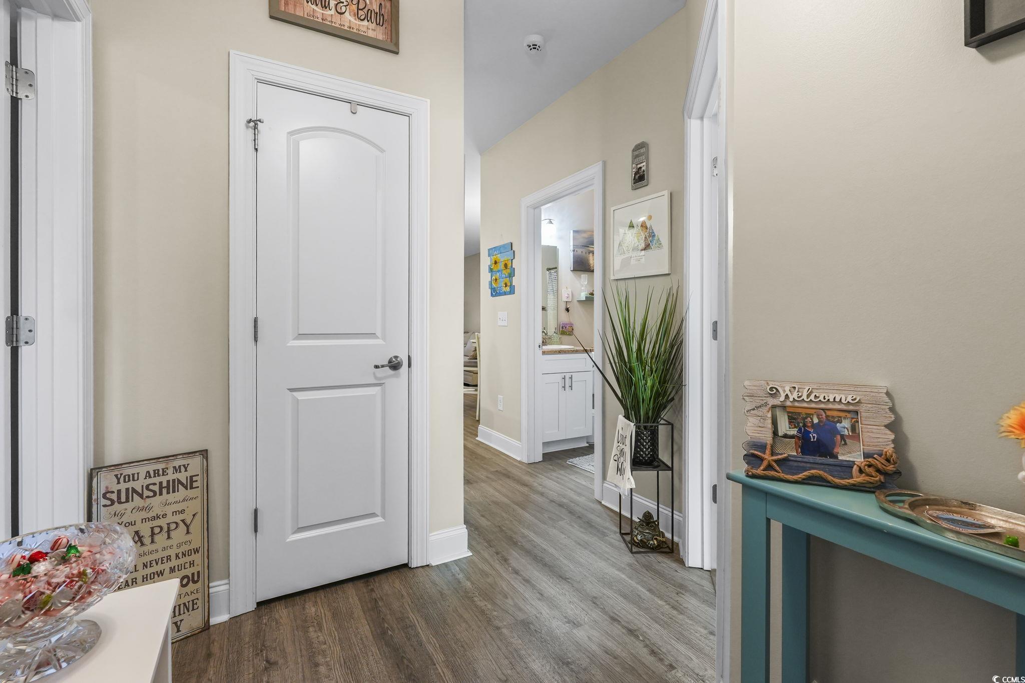 124 Birch N Coppice Drive, Unit 3 Surfside Beach, SC 29575 - Photo 16 of 40 Corridor with wood finished floors and baseboards