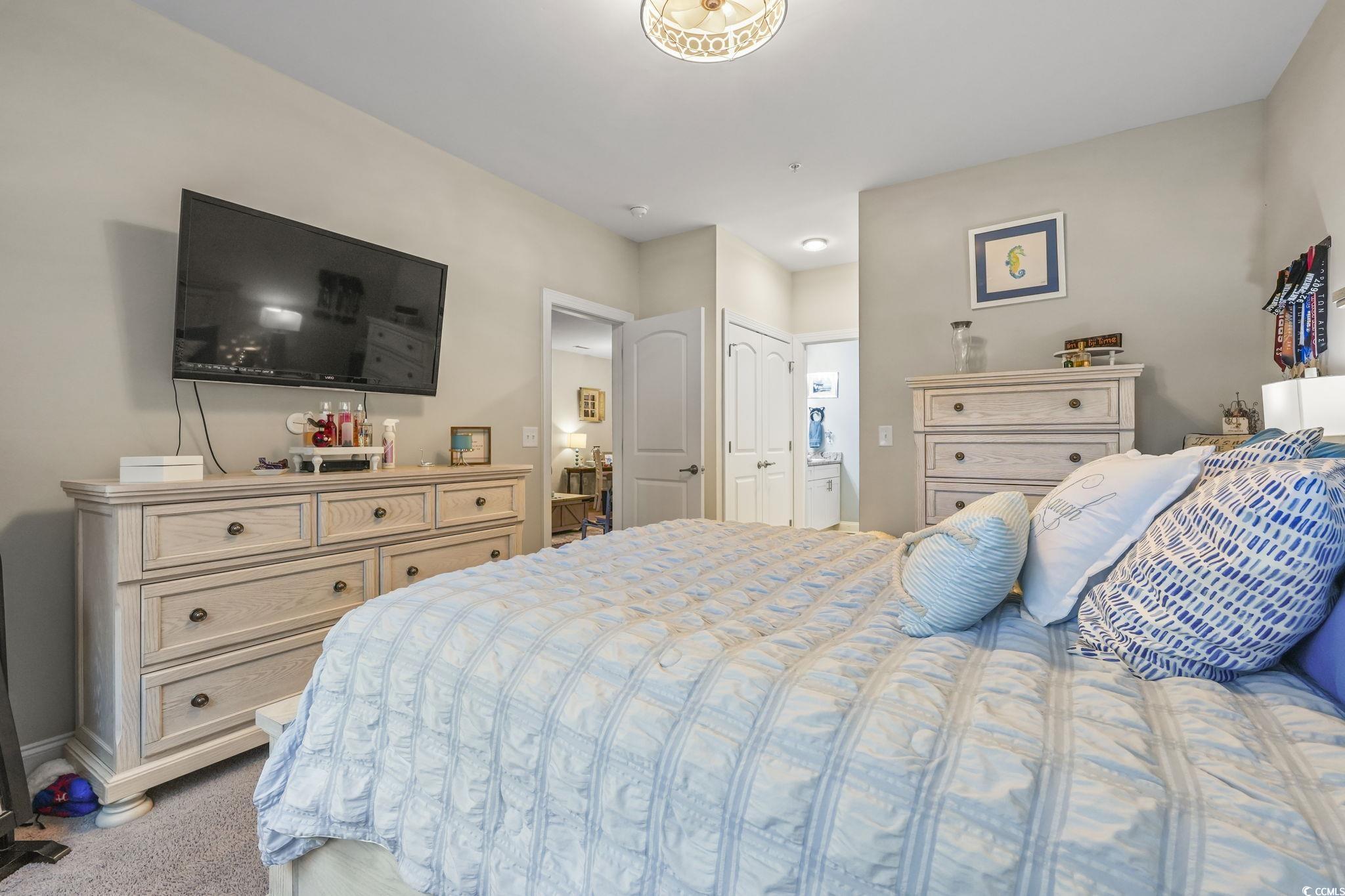 124 Birch N Coppice Drive, Unit 3 Surfside Beach, SC 29575 - Photo 17 of 40 Bedroom featuring light carpet and ensuite bathroom