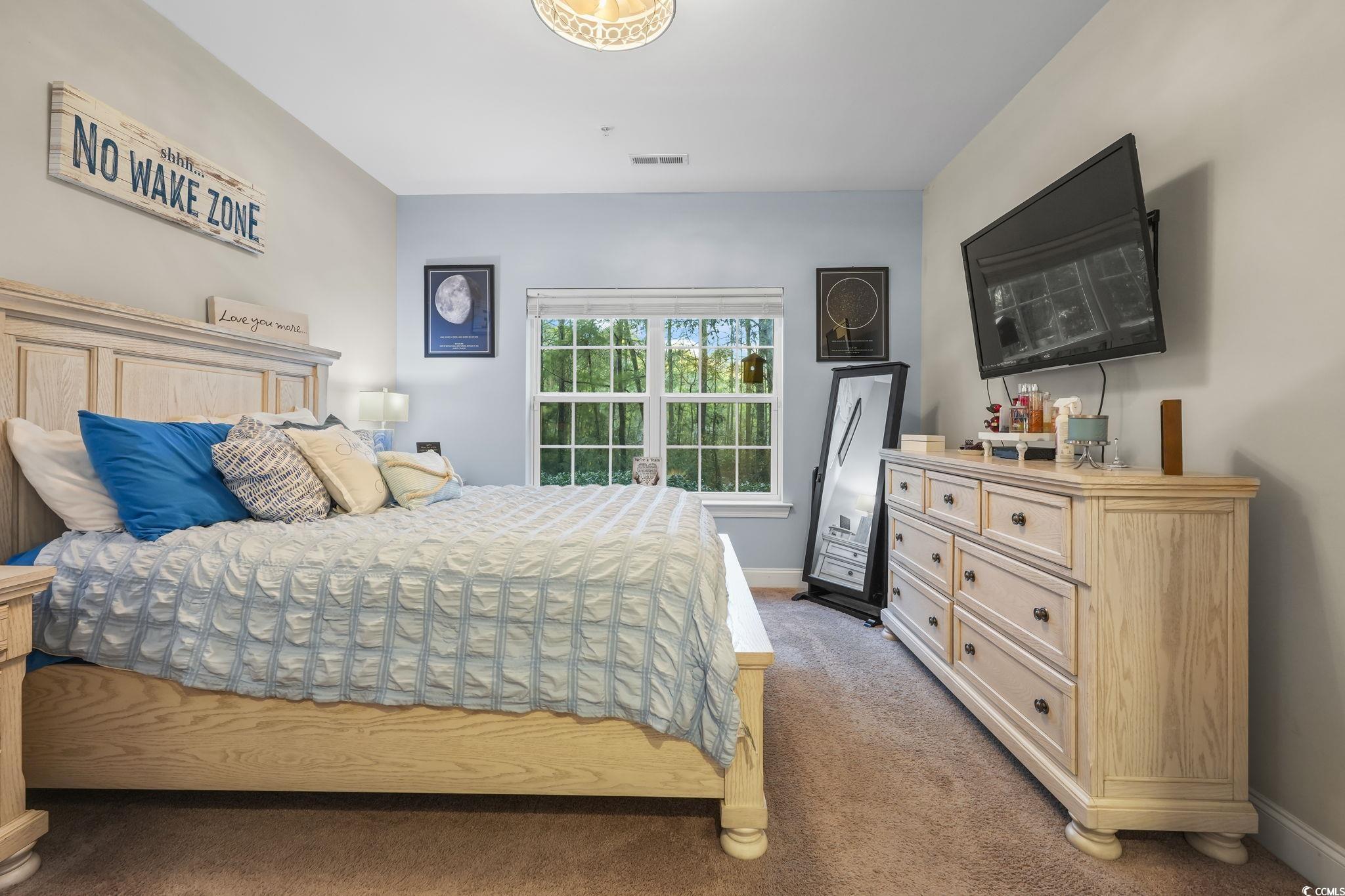 124 Birch N Coppice Drive, Unit 3 Surfside Beach, SC 29575 - Photo 19 of 40 Bedroom featuring light carpet and baseboards