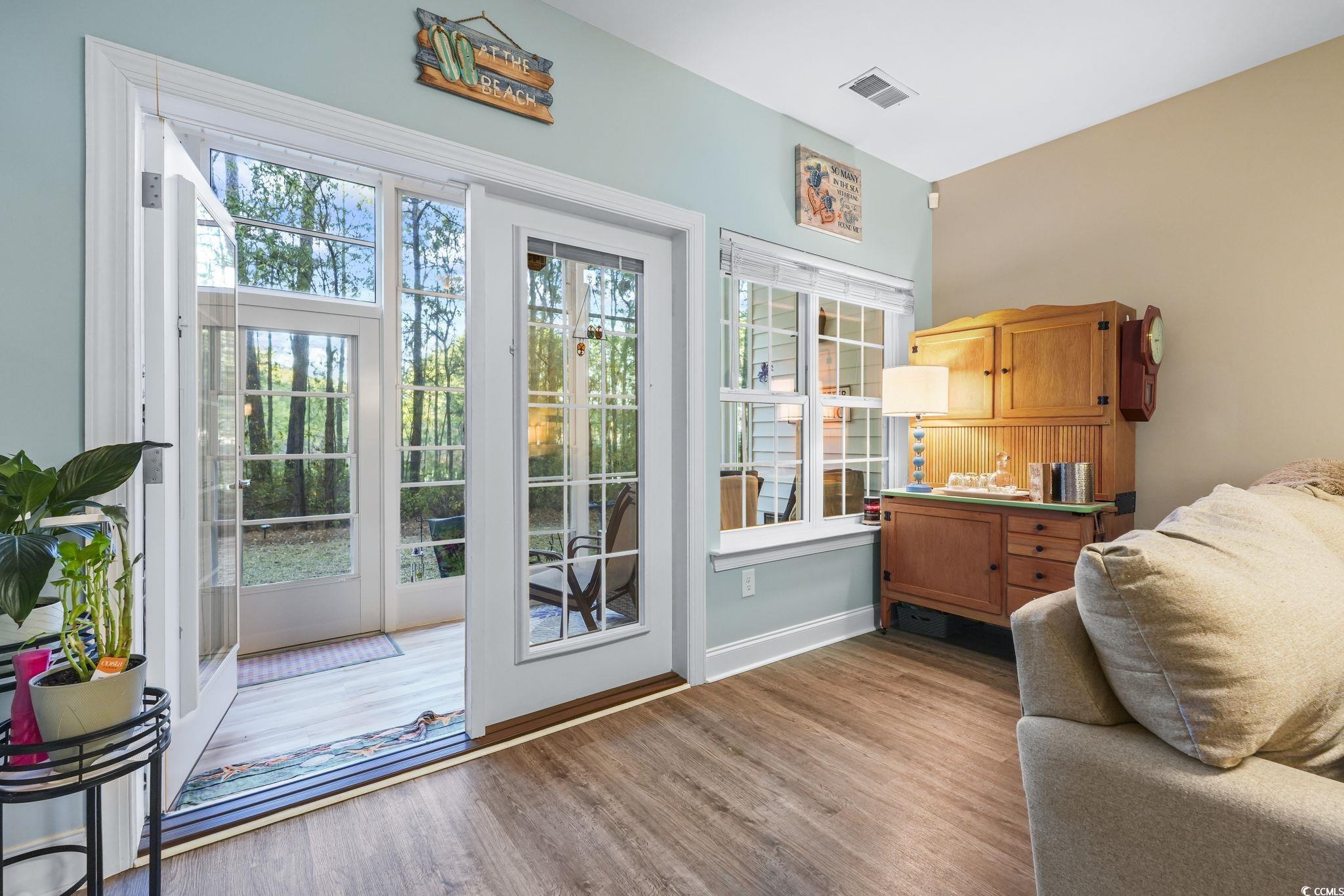 124 Birch N Coppice Drive, Unit 3 Surfside Beach, SC 29575 - Photo 27 of 40 Doorway with wood finished floors and baseboards