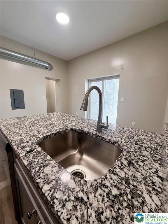 801 West Broad Street, Unit 1 Bethlehem, PA 18018 - Photo 16 of 31 a kitchen with a granite countertop sink a stove and refrigerator