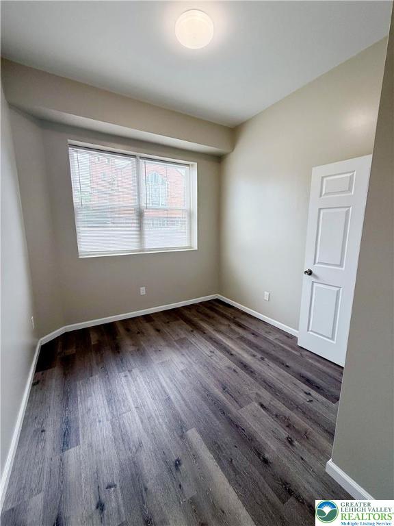 801 West Broad Street, Unit 1 Bethlehem, PA 18018 - Photo 23 of 31 an empty room with wooden floor and windows