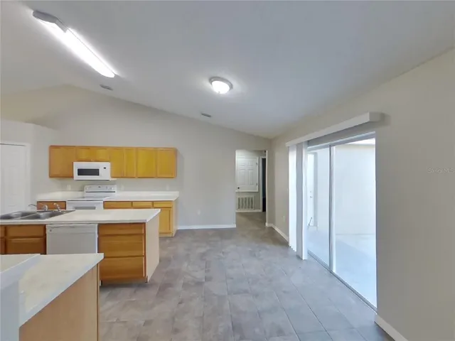 a view of a kitchen with a sink cabinets and a window