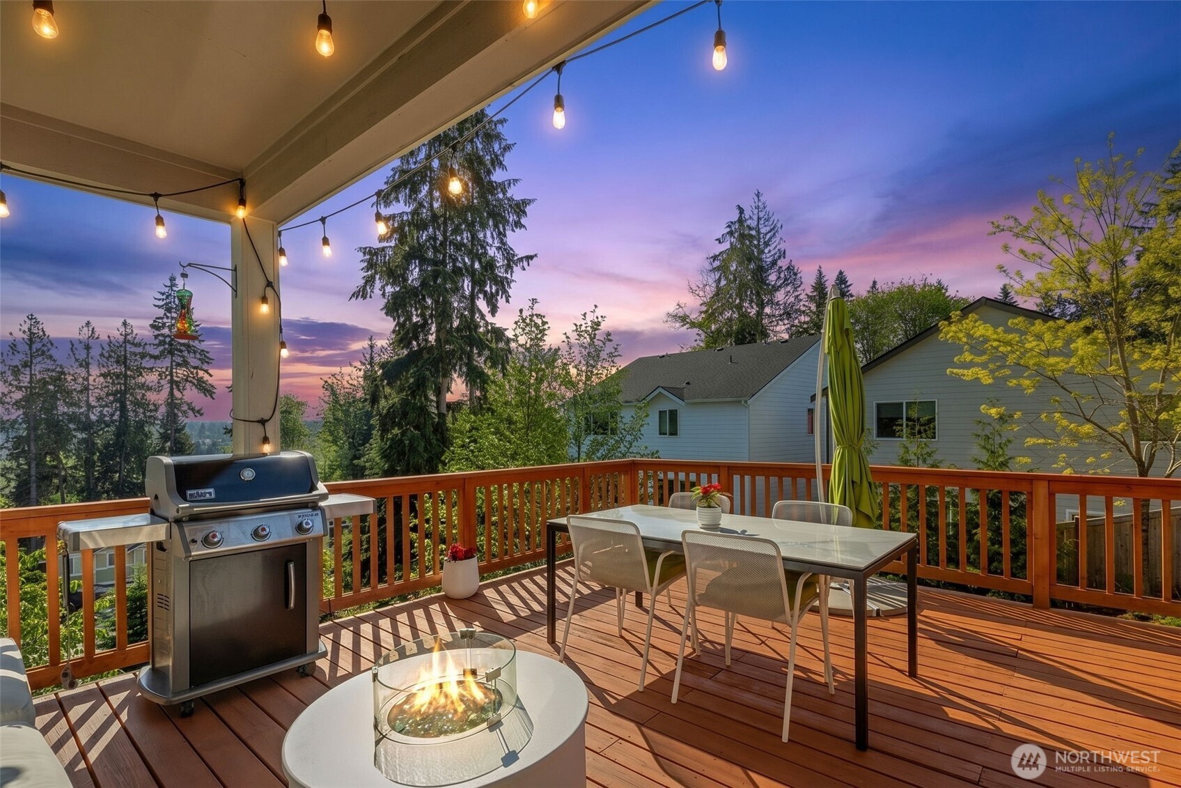 216 178th Street Southeast Bothell, WA 98012 - Photo 20 of 40 a view of a patio with a table and chairs with wooden floor and fence