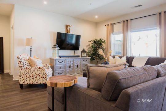 419 Abigail Street Ridgecrest, CA 93555 - Photo 7 of 34 a living room with furniture and a flat screen tv