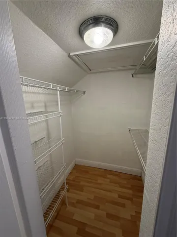 a view of a room with racks on the wall