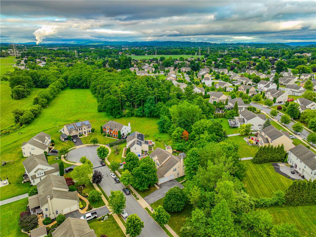 138 Clover Hollow Road Easton, PA 18045 - Photo 83 of 95 An aerial panorama reveals a serene residential neighborhood enveloped by lush green spaces and mature trees.