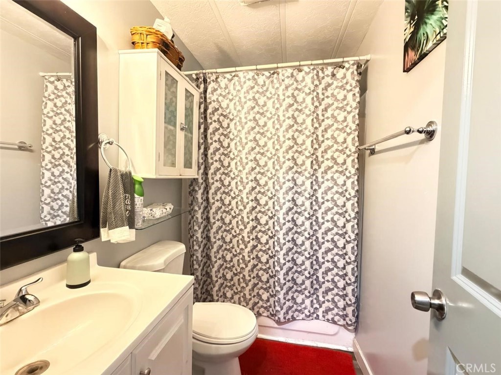 5700 Carbon Canyon Road, Unit 83 Brea, CA 92823 - Photo 12 of 24 a bathroom with a sink toilet and shower
