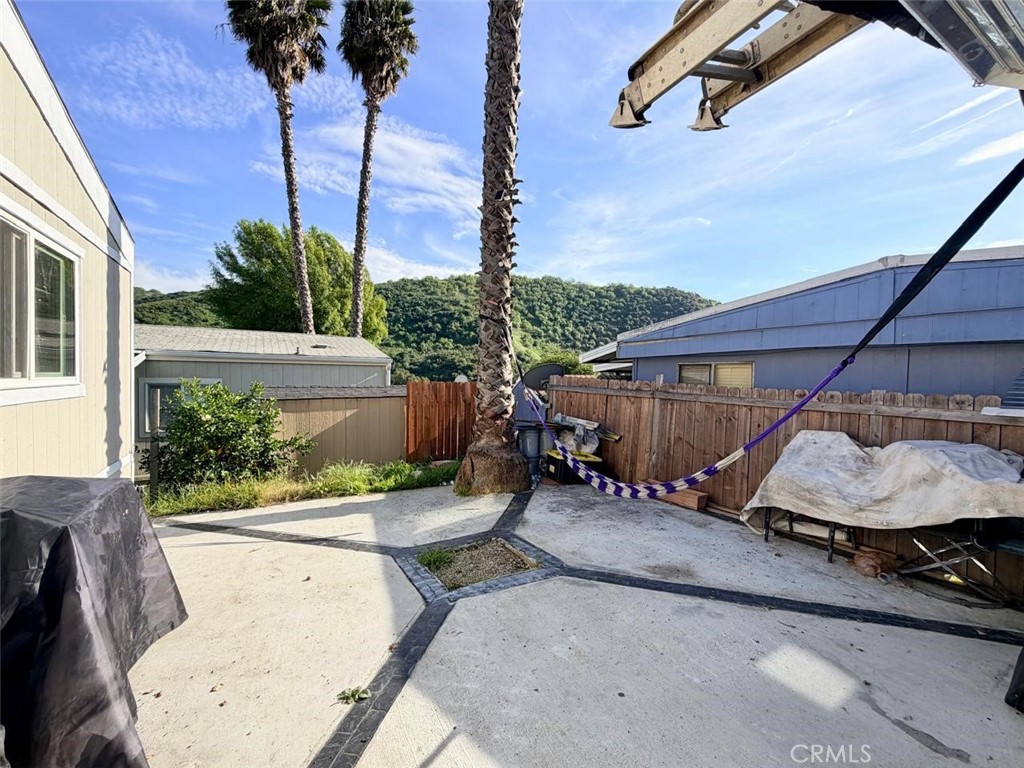 5700 Carbon Canyon Road, Unit 83 Brea, CA 92823 - Photo 14 of 24 a view of a patio with table and chairs potted plants