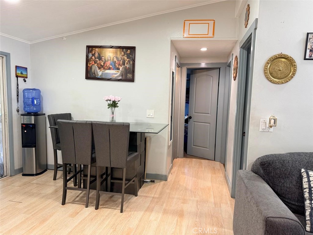 5700 Carbon Canyon Road, Unit 83 Brea, CA 92823 - Photo 5 of 24 a bedroom with a bed and a chandelier