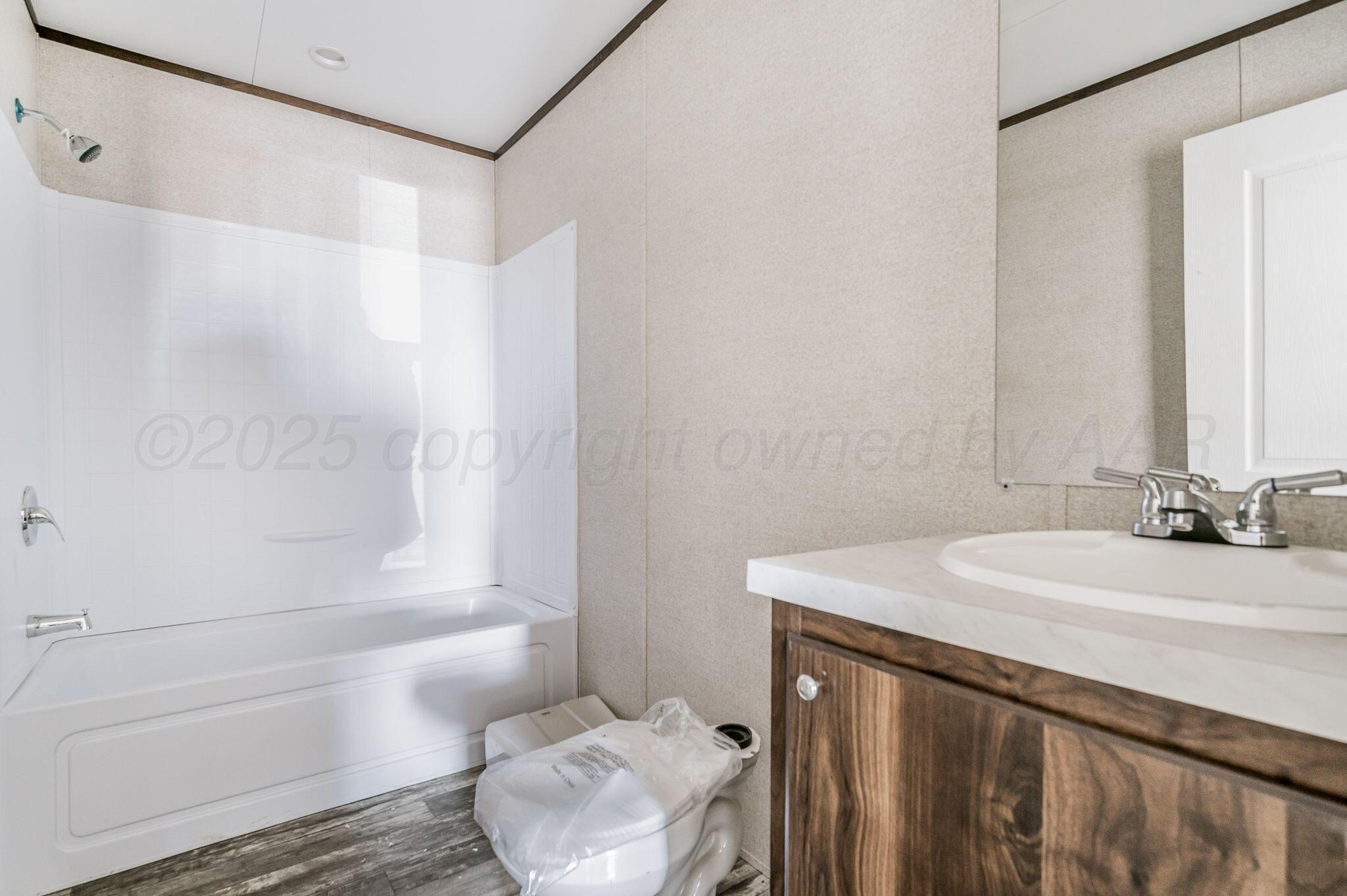 6300 Sawyer Road Amarillo, TX 79119 - Photo 13 of 16 Hall Bathroom