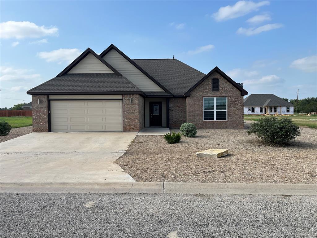1043 Cr 327a Glen Glen Rose, TX 76043 - Photo 1 of 10 a front view of a house with a yard and garage