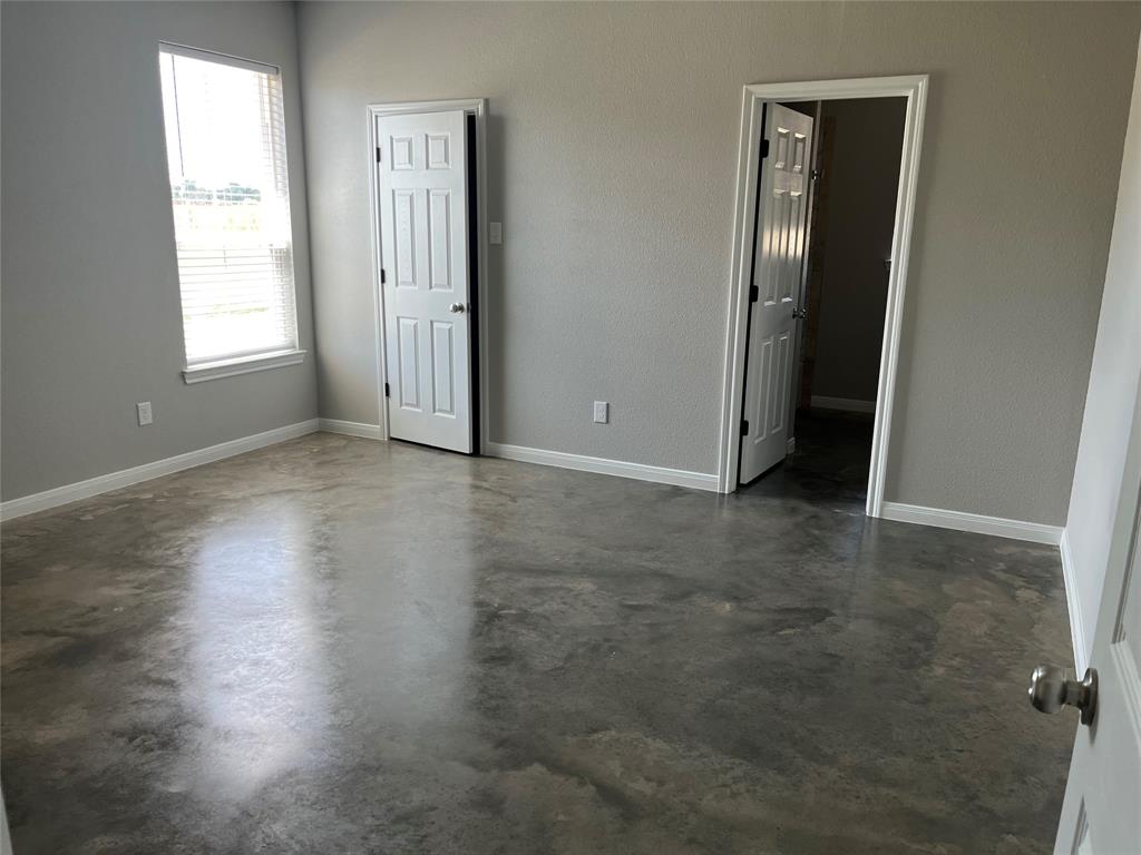 1043 Cr 327a Glen Glen Rose, TX 76043 - Photo 4 of 10 an empty room with closet and a window
